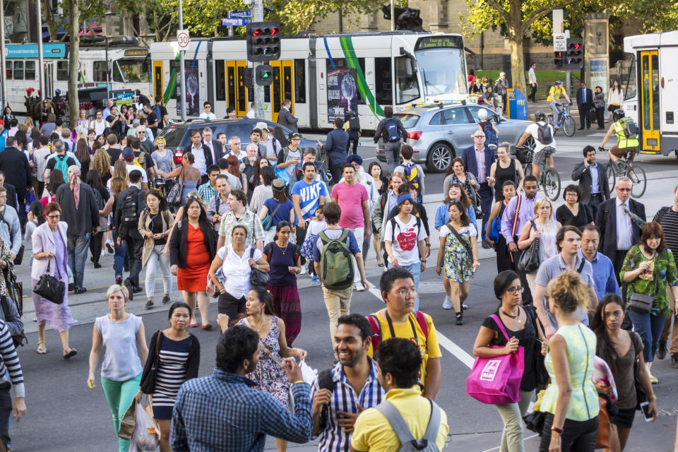 A busy pedestrian crossing in the Melbourne CBD