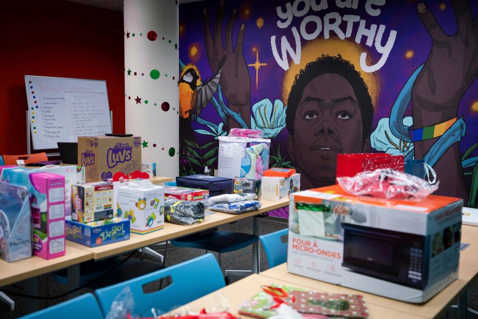 Christmas gifts are wrapped at the Detroit Phoenix Center, an organization that provides support for youths facing economic, social, and educational challenges, in Detroit on Dec. 13, 2022.