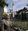 His Royal Highness Prince El Hassan bin Talal Hashemite of the Kingdom of Jordan walks past floral tribute outside the Al Noor mosque in Christchurch, New Zealand, Saturday, March 23, 2019. The mosque reopened today following the March 15 mass shooting. (AP Photo/Mark Baker)