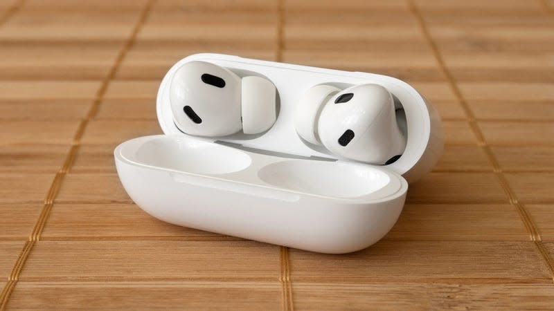 You can find the pairing button on the back of the AirPods case. - Photo: Andrew Liszewski / Gizmodo