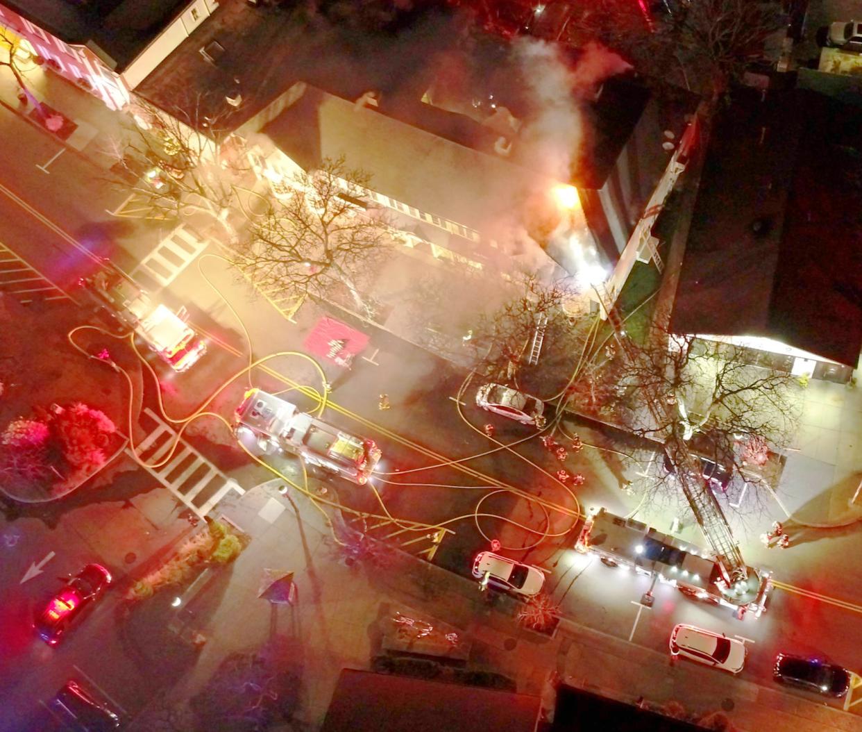 An aerial view of 172-176 Main St. in Falmouth as firefighters fought a smoky fire early Monday evening.