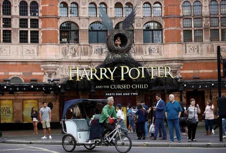 A bicycle-taxi passes The Palace Theatre where the Harry Potter and The Cursed Child play is being staged, in London, Britain July 29, 2016. REUTERS/Peter Nicholls