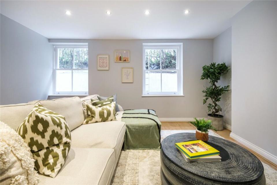 basement with white sofa