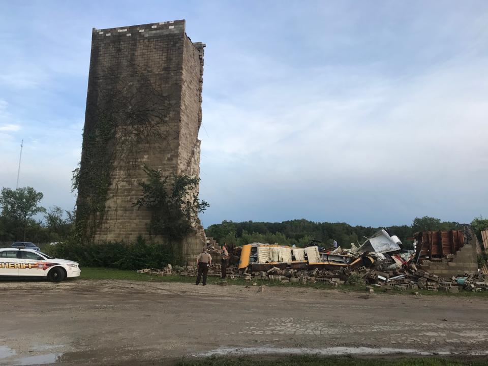 Between 50 and 100 onlookers stopped by the Hill-Top Drive-In to survey the damage. Image via John Ferak, Joliet Patch Editor