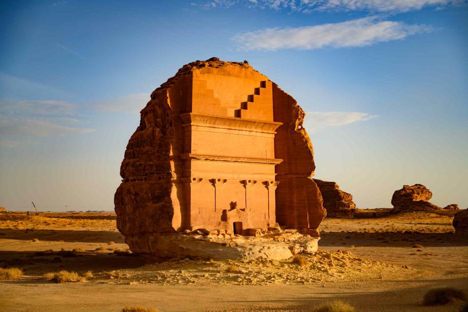 <p>JohnnyGreig/Getty Images</p> Hegra tomb in Alula, Saudi Arabia.