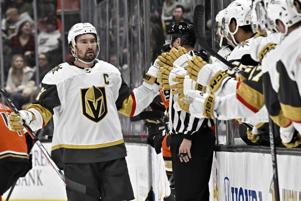 Vegas Golden Knights right wing Mark Stone, left, is congratulated after scoring a shorthanded goal against the Anaheim Ducks during the first period of an NHL hockey game in Anaheim, Calif., Wednesday, Dec. 28, 2022. (AP Photo/Alex Gallardo)