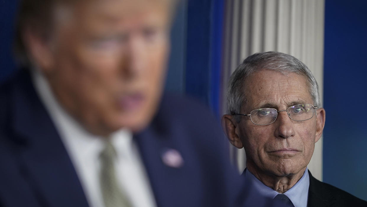 President Donald Trump speaks as National Institute Of Allergy And Infectious Diseases Director Dr. Anthony Fauci looks on during a press conference. (Photo by Drew Angerer/Getty Images)