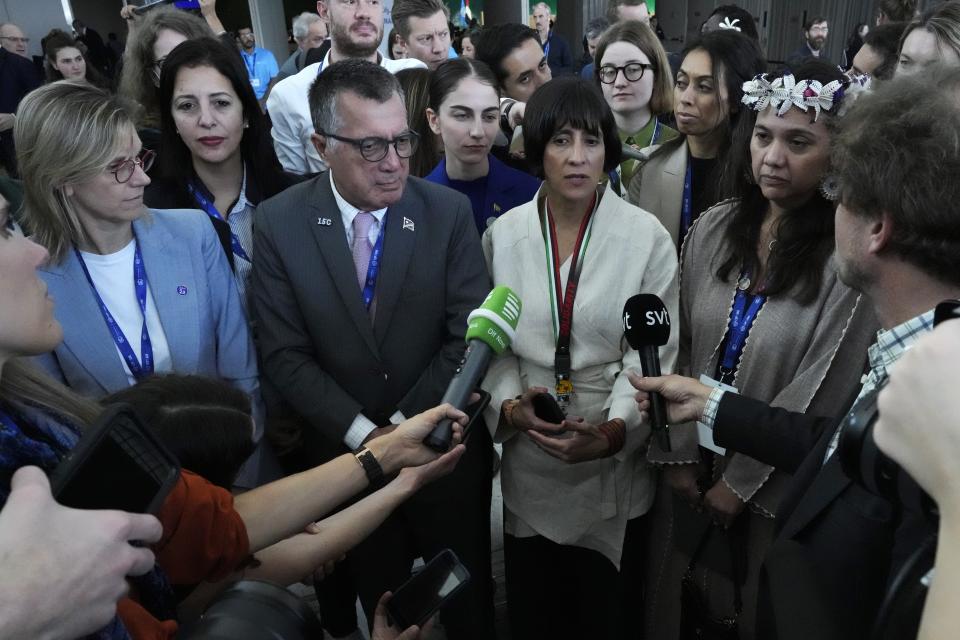 Susana Muhamad Gonzalez, Environment Minister of Colombia, center right, speaks next to France Energy Minister Agnes Pannier Runacher, left, John M. Silk, second from left, Marshall Islands natural resources and commerce minister, and Tina Stege, of the Marshall Islands, at the COP28 U.N. Climate Summit, Wednesday, Dec. 13, 2023, in Dubai, United Arab Emirates. (AP Photo/Peter Dejong)