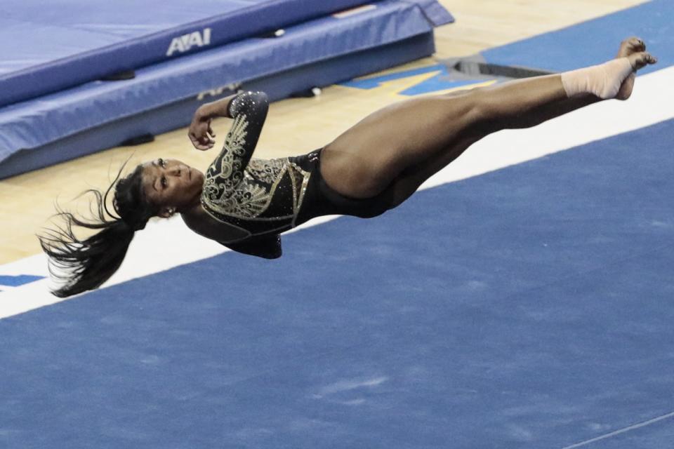 UCLA gymnast Nia Dennis competes in the floor exercise.