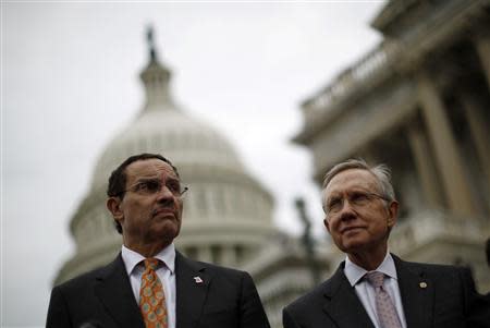 U.S. Senate Majority Leader Harry Reid (D-NV) and Washington D.C. Mayor Vincent Gray (L) are pictured on the steps of the U.S. Capitol in Washington, October 9, 2013. REUTERS/Jason Reed