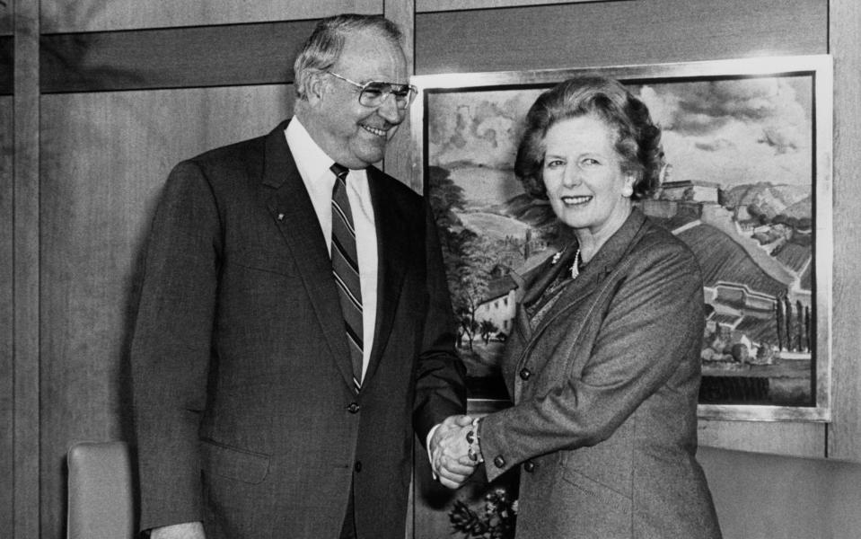Helmut Kohl with Margaret Thatcher in 1986 - Credit: PA Wire