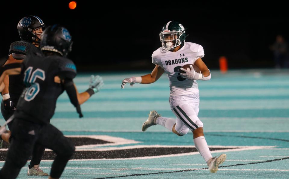 South Oldham’s Jacob Acevedo runs for a first down against North Oldham on Friday, Sept. 8, 2023.