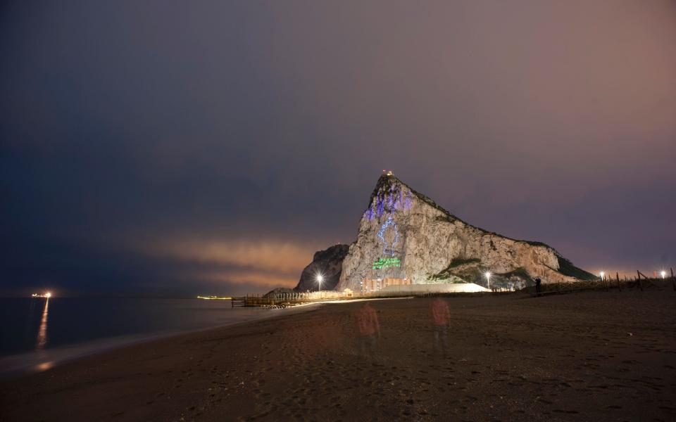 Queen Elizabeth II projected on the Rock of Gibraltar - Credit: JORGE GUERRERO/AFP