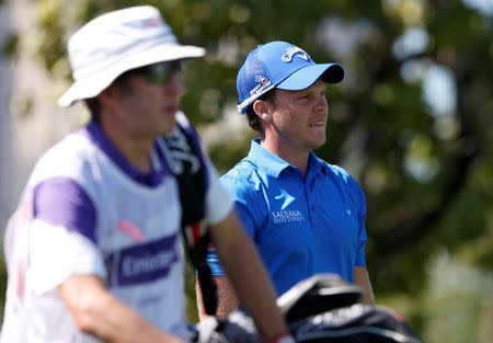 Danny Willett of England watches his tee off on the second hole during the Dubai Desert Classic golf championship February 7, 2016. REUTERS/Ahmed Jadallah