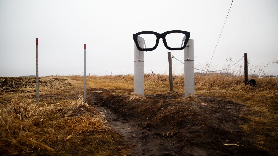 A pair of glasses marks the spot where a memorial to Buddy Holly, Ritchie Valens, and J.P. "the Big Bopper" Richardson sits in the field in Clear Lake where their plane crashed on Feb. 3, 1959, after their concert at the Surf Ballroom during the Winter Dance Party tour.