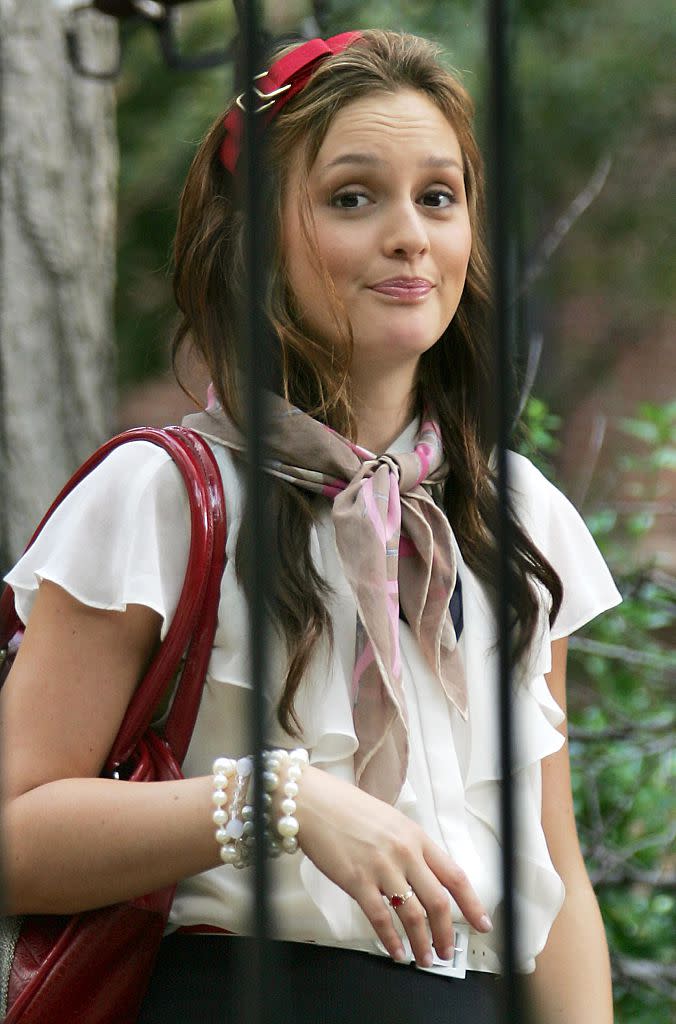 Leighton Meester in headband that resembles a dog collar.