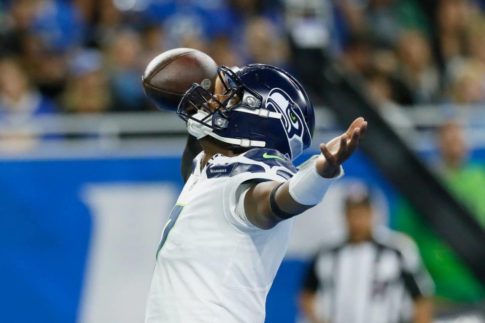 Seattle Seahawks quarterback Geno Smith reacts after his 8-yard touchdown run during the first half of an NFL football game against the Detroit Lions, Sunday, Oct. 2, 2022, in Detroit. (AP Photo/Duane Burleson)