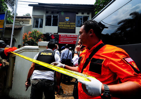 Police secure the area around a local government office following an explosion in Bandung, West Java, Indonesia February 27, 2017 in this photo taken by Antara Foto. Antara Foto/Novrian Arbi/ via REUTERS