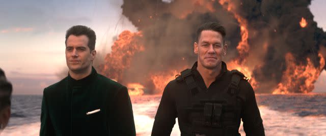 <p>Universal Pictures</p> Henry Cavill and John Cena in "Argylle"