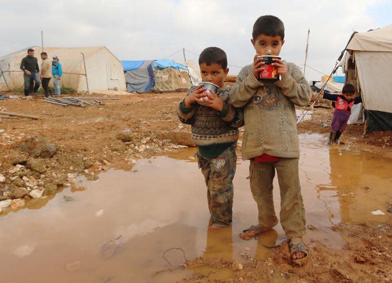 A million people were internally displaced by the Syrian conflict in 2014, such as these children at the Bab Al-Salama camp on the border with Turkey