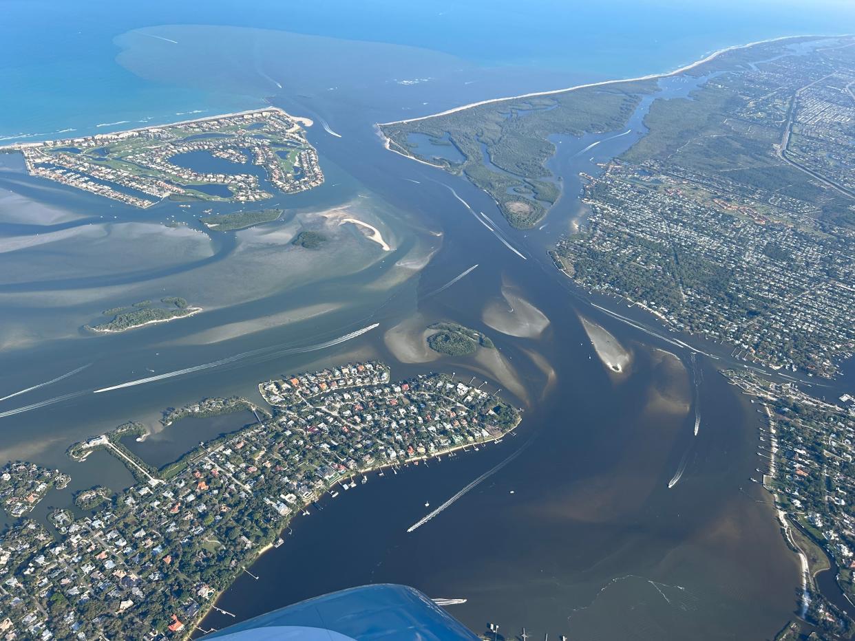 An aerial views of the St. Lucie Inlet on Feb. 26, 2024 shows the dark water from Lake Okeechobee discharges entering the South Fork 9 miles upstream.