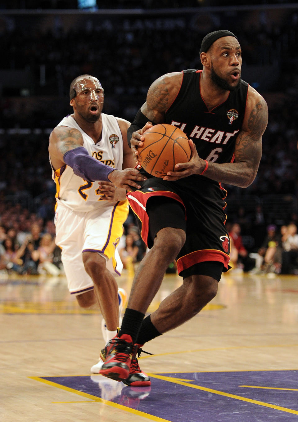 LOS ANGELES, CA - MARCH 04: LeBron James #6 of the Miami Heat drives to the basket past Kobe Bryant #24 of the Los Angeles Lakers during a 93-83 Laker win at Staples Center on March 4, 2012 in Los Angeles, California. NOTE TO USER: User expressly acknowledges and agrees that, by downloading and or using this photograph, User is consenting to the terms and conditions of the Getty Images License Agreement. (Photo by Harry How/Getty Images)