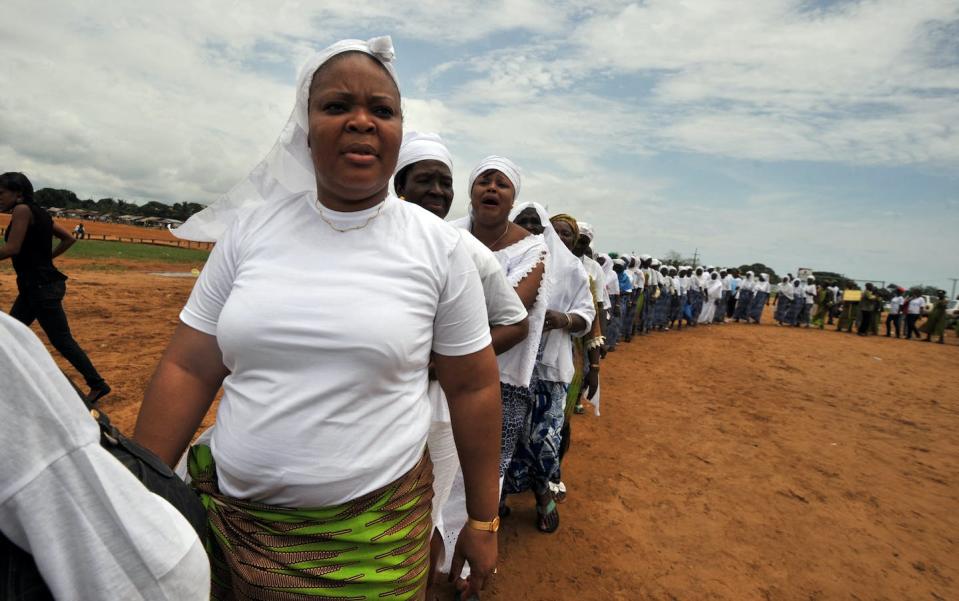 Leymah Gbowee, who was a joint Nobel Peace Prize winner in 2011, marches with women’s rights activists to pray for peace in Monrovia, Liberia. <a href="https://www.gettyimages.com/detail/news-photo/liberias-joint-nobel-peace-prize-2011-leymah-gbowee-and-news-photo/1250772202?adppopup=true" rel="nofollow noopener" target="_blank" data-ylk="slk:Issouf Sanogo/AFP via Getty Images;elm:context_link;itc:0;sec:content-canvas" class="link ">Issouf Sanogo/AFP via Getty Images</a>