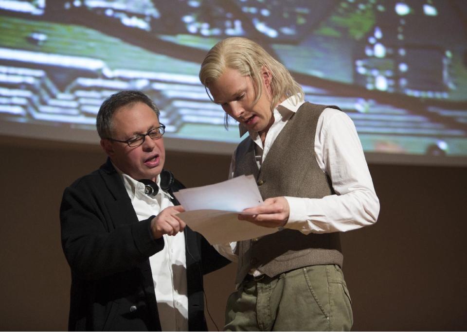 This image released by Dreamworks Pictures shows director Bill Condon, left, with actor Benedict Cumberbatch on the set of "The Fifth Estate." (AP Photo/Dreamworks Pictures, Frank Connor)