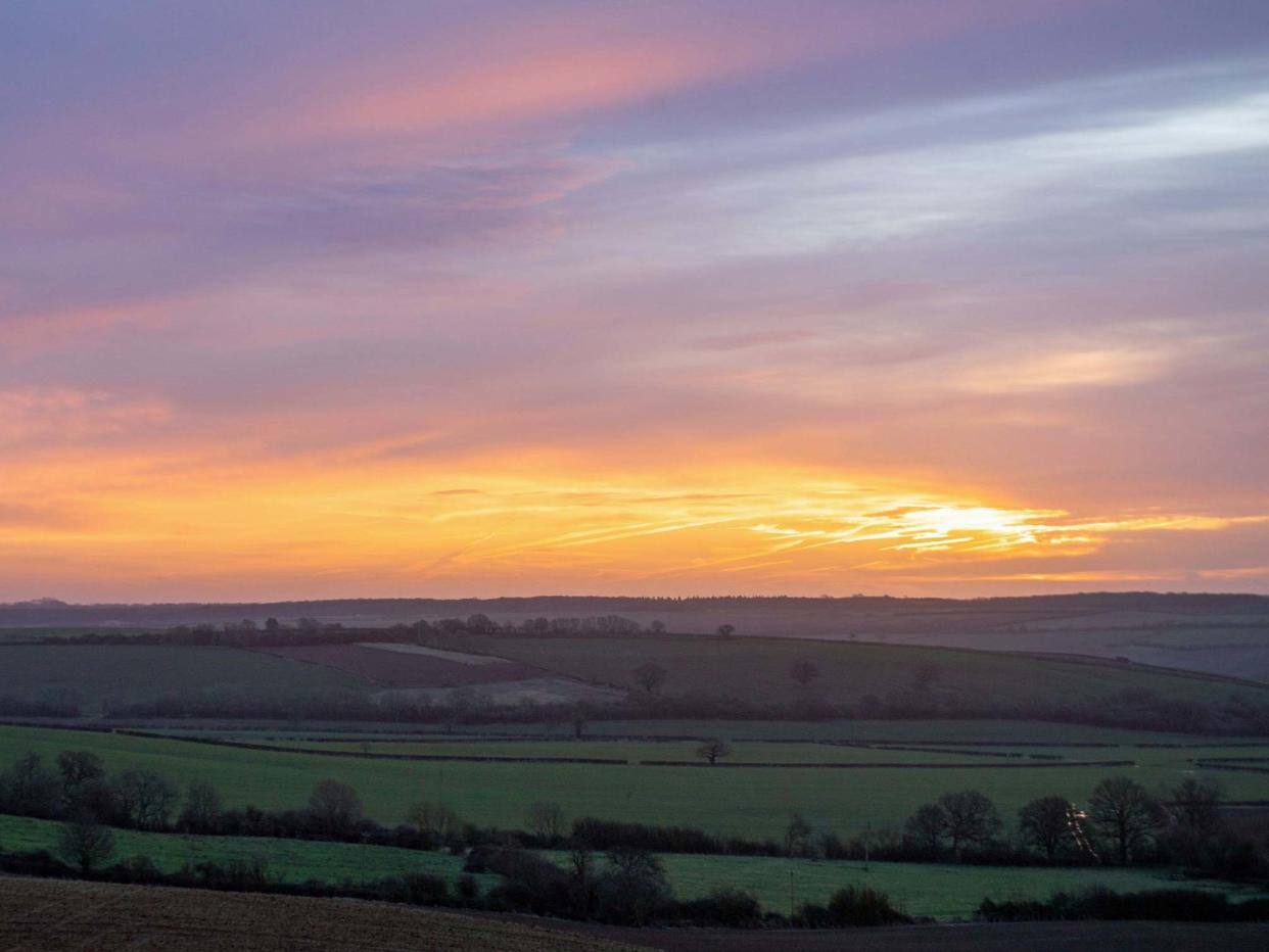 Winter sun rises over fields near Morcott in Rutland: Joe Giddens/PA Wire