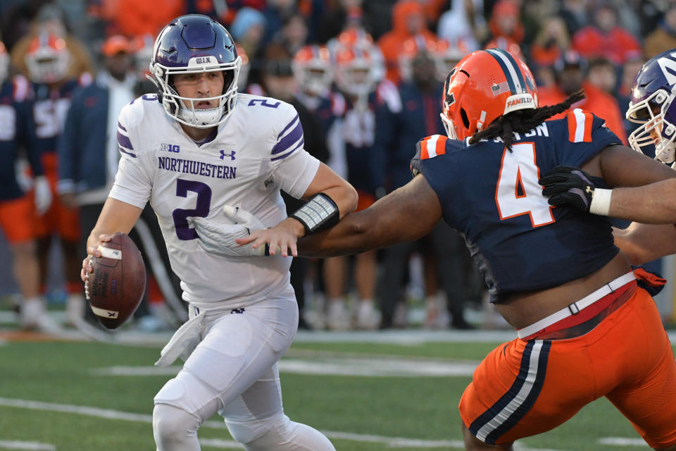 Nov 25, 2023; Champaign, Illinois, USA; Illinois Fighting Illini defensive tackle Jer’Zhan Newton (4) sacks Northwestern Wildcats quarterback <a class="link " href="https://sports.yahoo.com/ncaaf/players/286715/" data-i13n="sec:content-canvas;subsec:anchor_text;elm:context_link" data-ylk="slk:Ben Bryant;sec:content-canvas;subsec:anchor_text;elm:context_link;itc:0">Ben Bryant</a> (2) during the first half at Memorial Stadium. Mandatory Credit: Ron Johnson-USA TODAY Sports