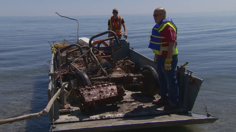 Boat cleanup targets vehicle carcasses, trash dumped over Scarborough Bluffs