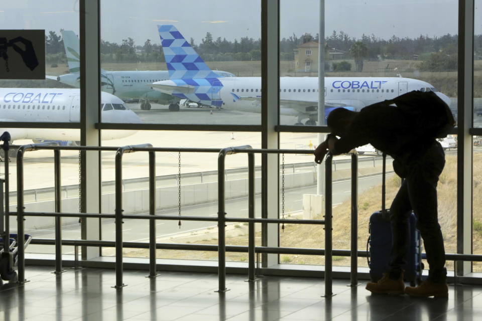 A Cobalt aircraft sits at Larnaca international airport in Cyprus, Thursday, Oct. 18, 2018. Cyprus-based airline Cobalt Air says it has indefinitely suspended all of its operations, Thursday, amid a struggle to find investors. (AP Photo/Petros Karadjias)