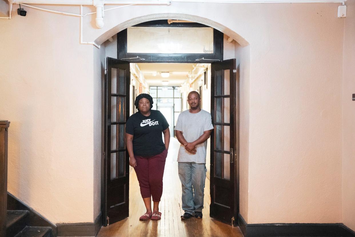 Katherine Harris and Fred Scott stand for a portrait together in the lobby of their apartment building earlier this month.