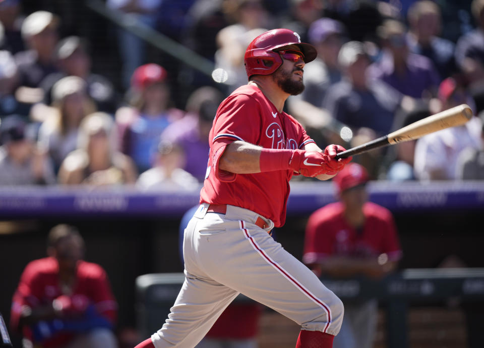 Philadelphia Phillies' Kyle Schwarber follows the flight of his solo home run of Colorado Rockies starting pitcher German Marquez in the sixth inning of a baseball game Wednesday, April 20, 2022, in Denver. (AP Photo/David Zalubowski)