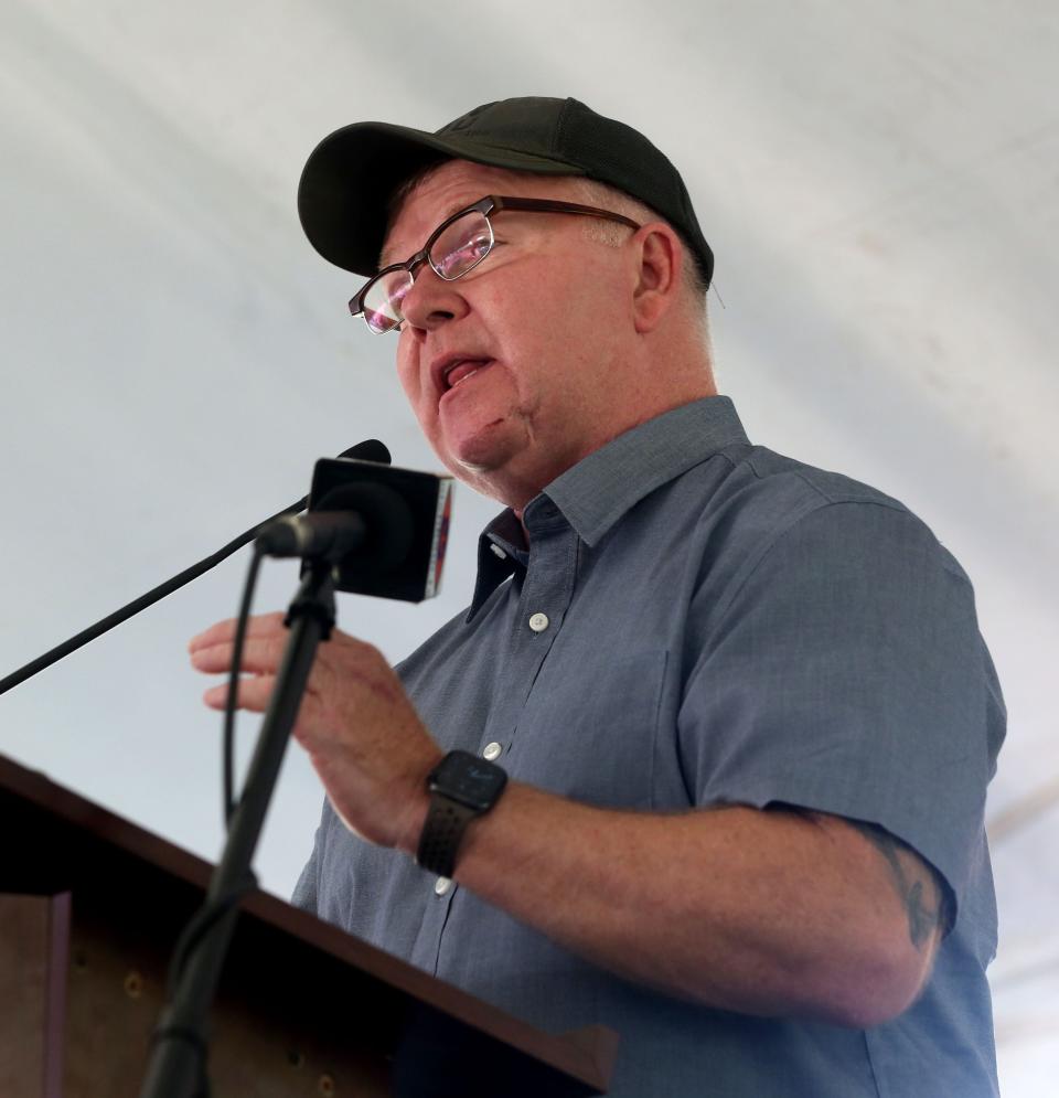 Brian Murphy, who was the first police officer to respond to the Aug. 5, 2012, mass shooting at the Sikh Temple of Wisconsin, speaks at the 10th annual Oak Creek Sikh Memorial Anniversary Candlelight Remembrance Vigil on Friday in Oak Creek.