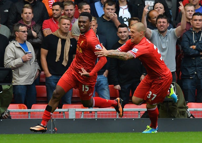 Liverpool's Daniel Sturridge (left) and Martin Skrtel celebrate at Anfield stadium in Liverpool on September 1, 2013