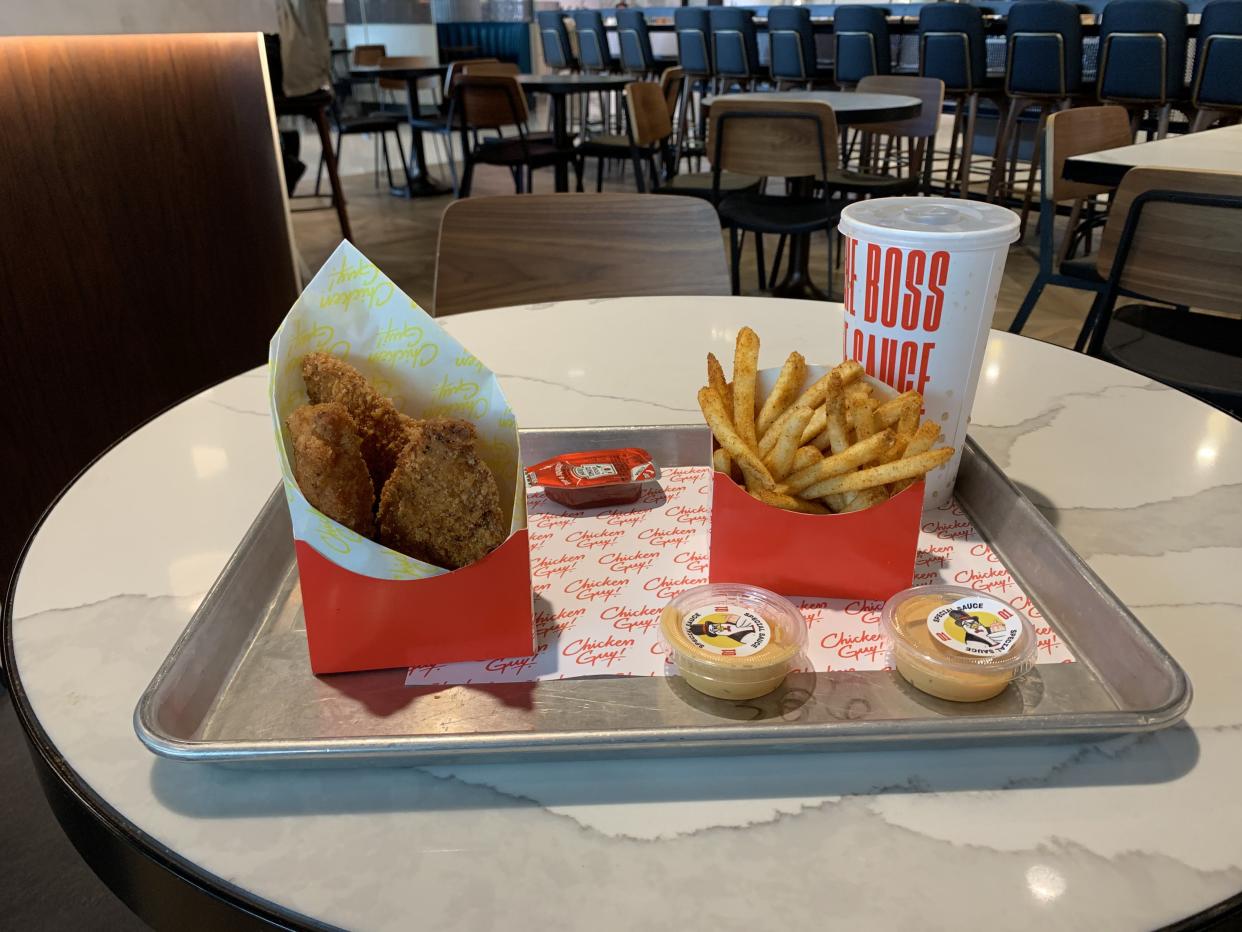 chicken tenders and fries with sauce at food court