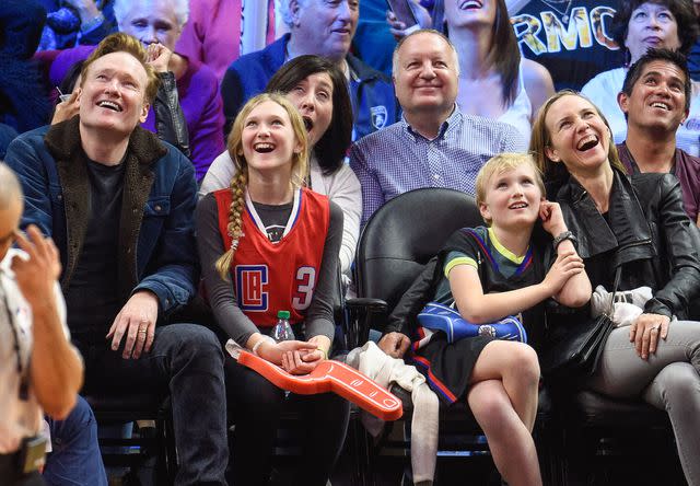 <p>Noel Vasquez/GC Images</p> Conan O'Brien, Neve O'Brien, Beckett O'Brien and Liza Powel attend a basketball game between the Houston Rockets and the Los Angeles Clippers on January 18, 2016 in Los Angeles, California.