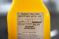A "SELL BY" date is circled on a half gallon of fresh squeezed orange juice, Sunday, Aug. 21, 2022, in Chicago. As awareness grows around the world about the problem of food waste, one culprit in particular is drawing scrutiny: “best before” labels. Manufacturers have used the labels for decades to estimate peak freshness. Unlike “use by” labels, which are found on perishable foods like meat and dairy, “best before” labels have nothing to do with safety and may encourage consumers to throw away food that’s perfectly fine to eat. (AP Photo/Charles Rex Arbogast)