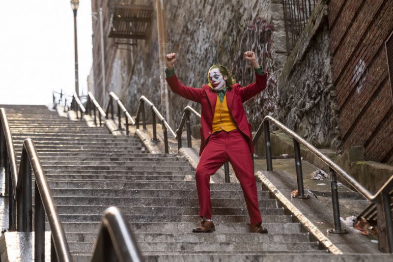 Joaquin Phoenix dances to Gary Glitter's track in Joker (Credit: Warner Bros)