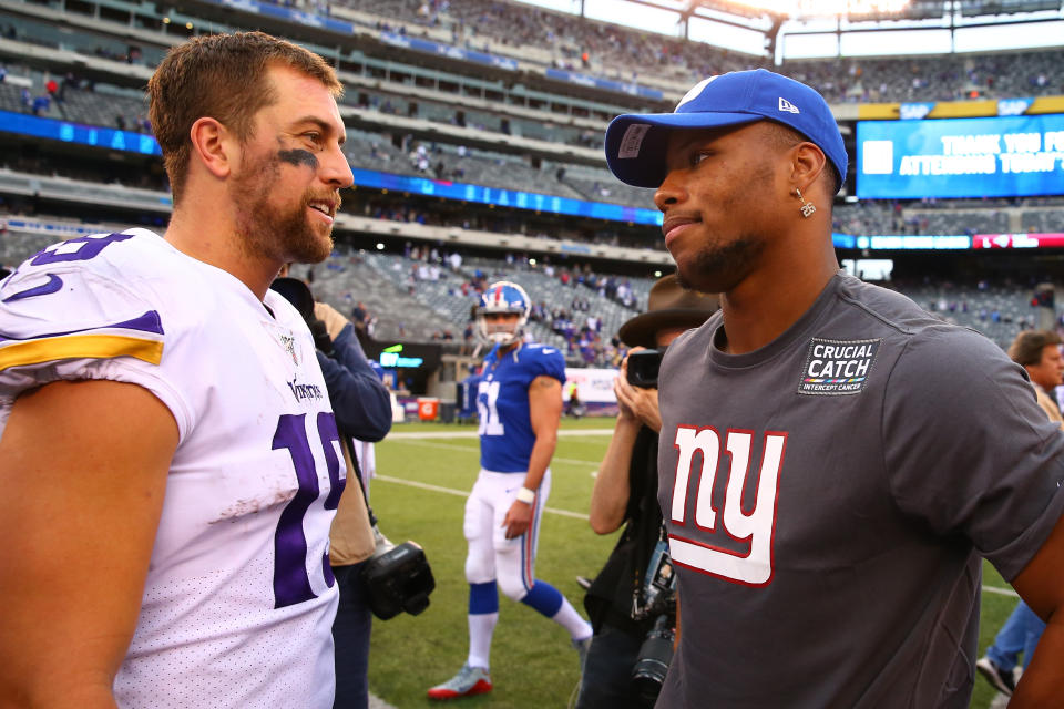 New York Giants running back Saquon Barkley (26) and Minnesota Vikings wide receiver Adam Thielen (19) after a Week 5 game. (Getty Images)