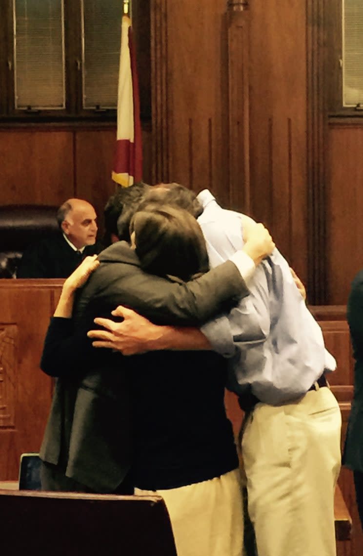 Caroline Malatesta embraces her husband and lawyer after winning a $16 million lawsuit over a traumatic birth experience that left her injured. (Photo: Courtesy Caroline Malatesta)