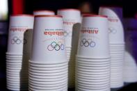 Cups with a logo of Alibaba Group are seen during Alibaba Group's 11.11 Singles' Day global shopping festival at a media center in Hangzhou