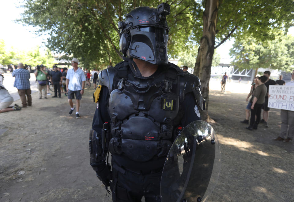 <p>A right-wing supporter of the Patriot Prayer group wears protective gear during a rally in Portland, Ore., Aug. 4, 2018. (Photo: Jim Urquhart/Reuters) </p>