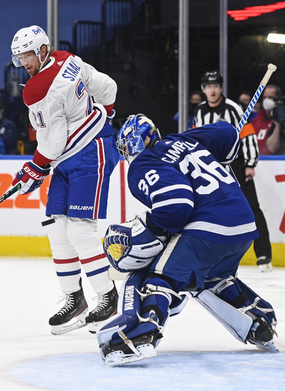 Toronto Maple Leafs goaltender Jack Campbell (36) makes a save as Montreal Canadiens forward Eric Staal (21) looks for the rebound during the second period of an NHL hockey game Wednesday, April 7, 2021, in Toronto. (Nathan Denette/The Canadian Press via AP)