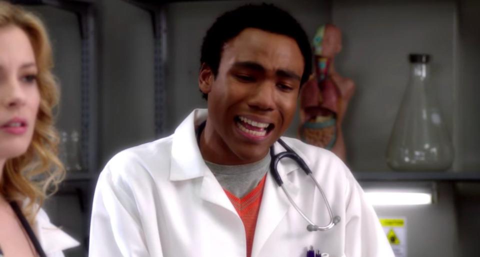 Troy, dressed as a doctor, crying next to Britta in "Community"