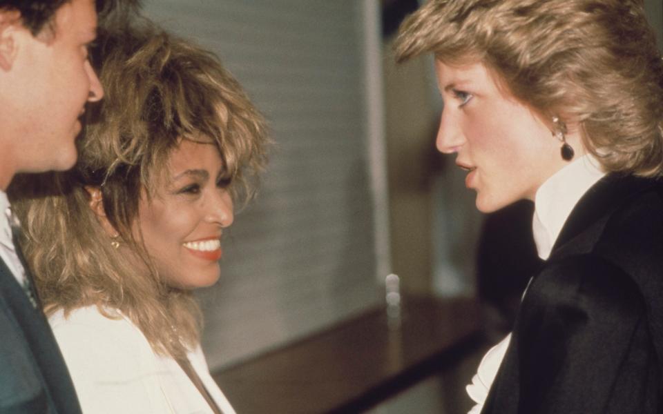 Diana, Princess of Wales meets singers Paul Young (left) and Tina Turner (centre) backstage at a Prince's Trust charity concert in 1986 - Hulton Royals Collection/Getty Images