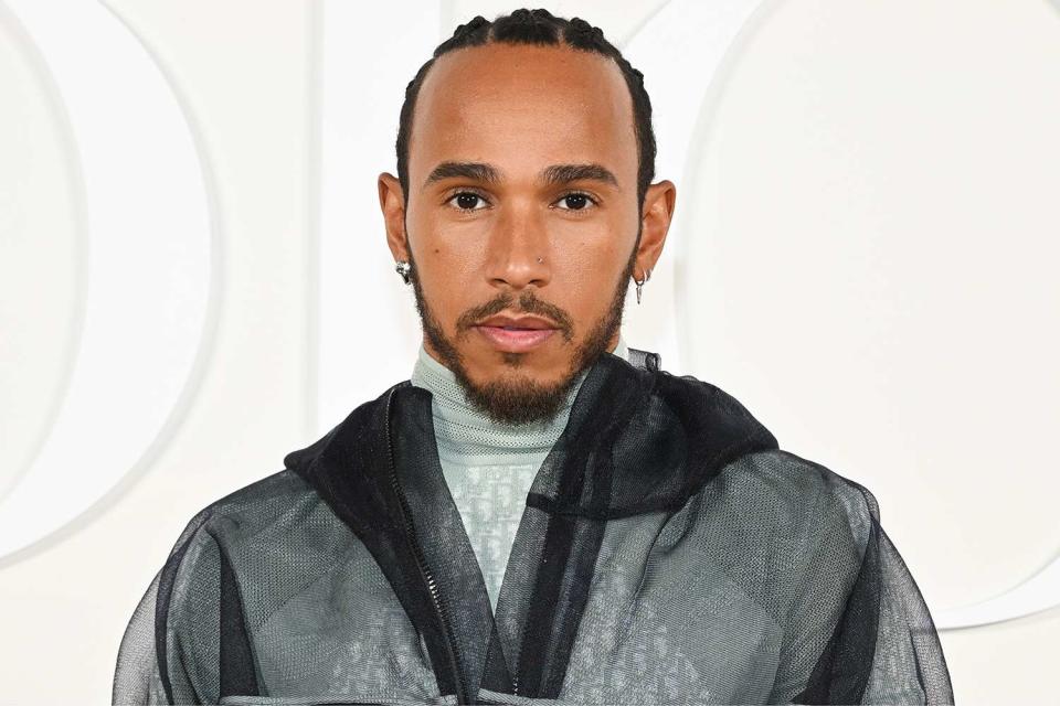 <p>Stephane Cardinale - Corbis/Corbis via Getty</p> Lewis Hamilton attends the Dior Fall 2023 Menswear Show