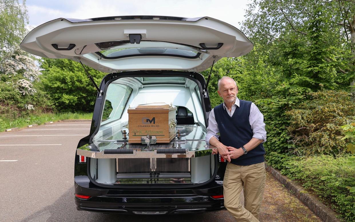 Jeremy Taylor photographed for The Telegraph trying out an electric (EV) hearse in Stratford-on-Avon