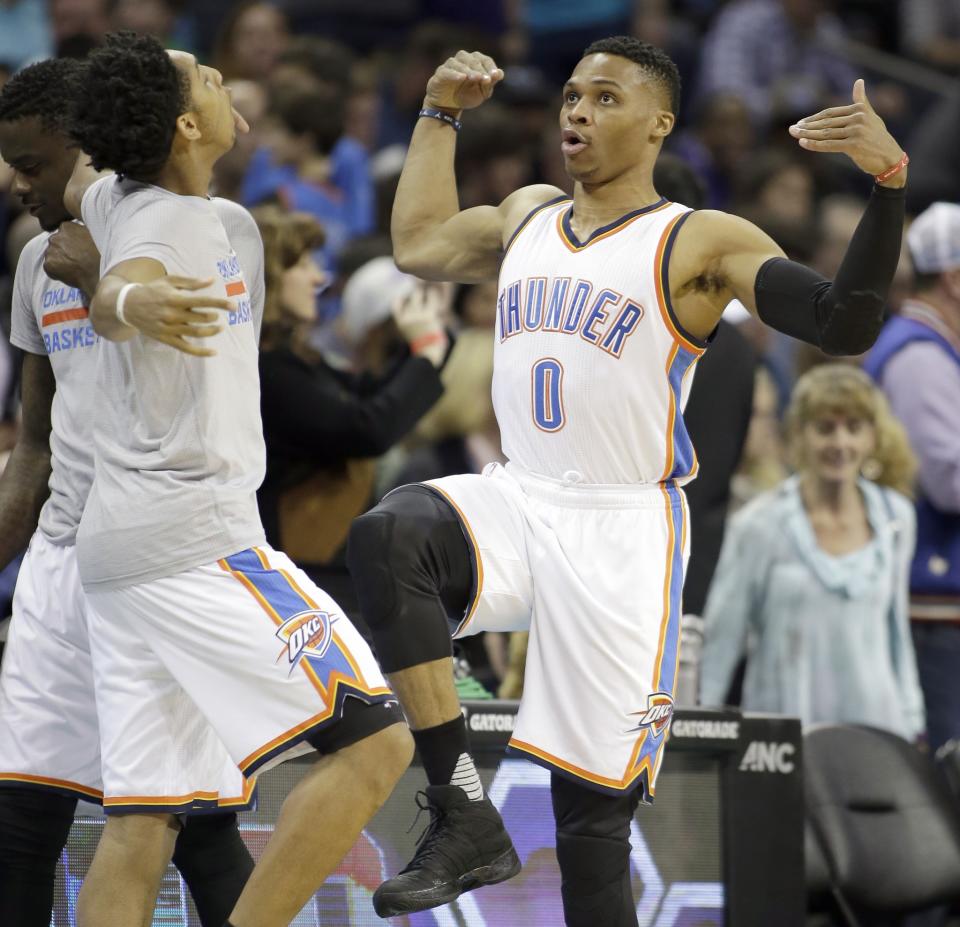 Payne and Russell Westbrook perform their pregame dance ritual earlier this season. (AP)